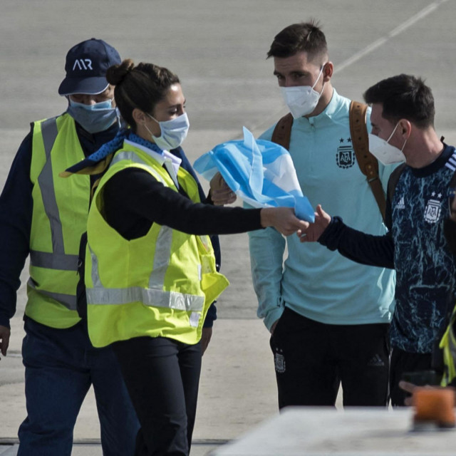 &lt;p&gt;(FILES) In this file photo taken on July 11, 2021 a worker gives an Argentinian flag to Argentina&amp;#39;s Lionel Messi (2-R), next to teammate Giovani Lo Celso (3-R), upon their arrival at the Islas Malvinas airport in Rosario, Santa Fe province, Argentina, after Argentina won the 2021 Copa America final football match against Brazil. - Forty years after the Falklands/Malvinas war Argentina continues to claim sovereignty over the islands, which the country&amp;#39;s then military junta invaded on April 2, 1982. More than 900 people died, including 655 Argentines, 255 British troops and three islanders, before Argentine forces surrendered on June 14, 1982. Argentina returned to democracy in 1983. (Photo by AFP)&lt;/p&gt;