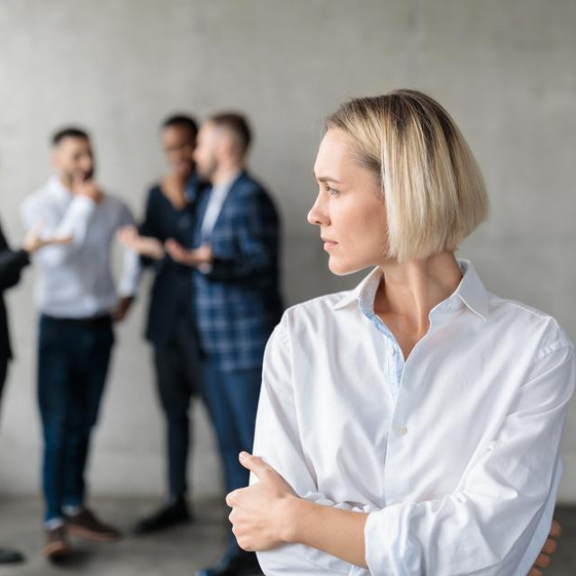 &lt;p&gt;Male Coworkers Whispering Behind Back Of Unhappy Businesswoman Spreading Rumors And Gossips Standing In Modern Office. Sexism And Bullying Problem At Workplace Concept. Selective Focus&lt;/p&gt;