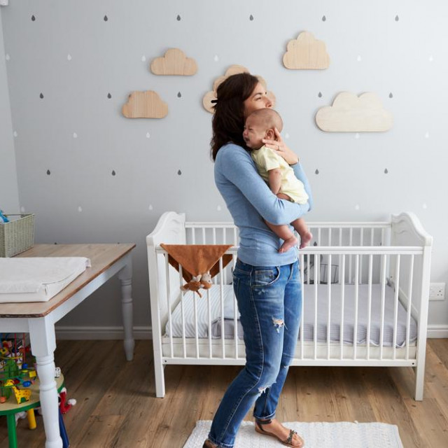 &lt;p&gt;Mother Comforting Newborn Baby Son In Nursery&lt;/p&gt;