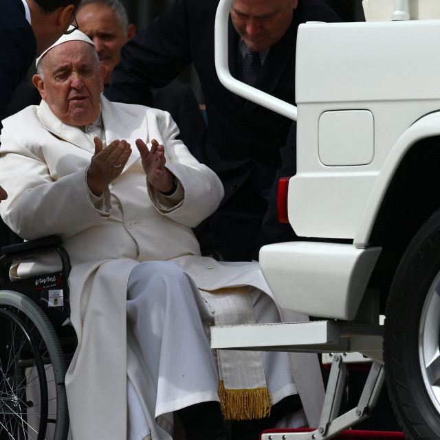 &lt;p&gt;TOPSHOT - Pope Francis speaks with his aides prior to being helped get up the popemobile car from his wheelchair, as he leaves on March 29, 2023 at the end of the weekly general audience at St. Peter‘s square in The Vatican. - Pope Francis has been at the Gemelli Hospital in Rome since the afternoon of March 29, 2023 for some previously scheduled check-ups, the Holy See press director said. (Photo by Vincenzo PINTO/AFP)&lt;/p&gt;