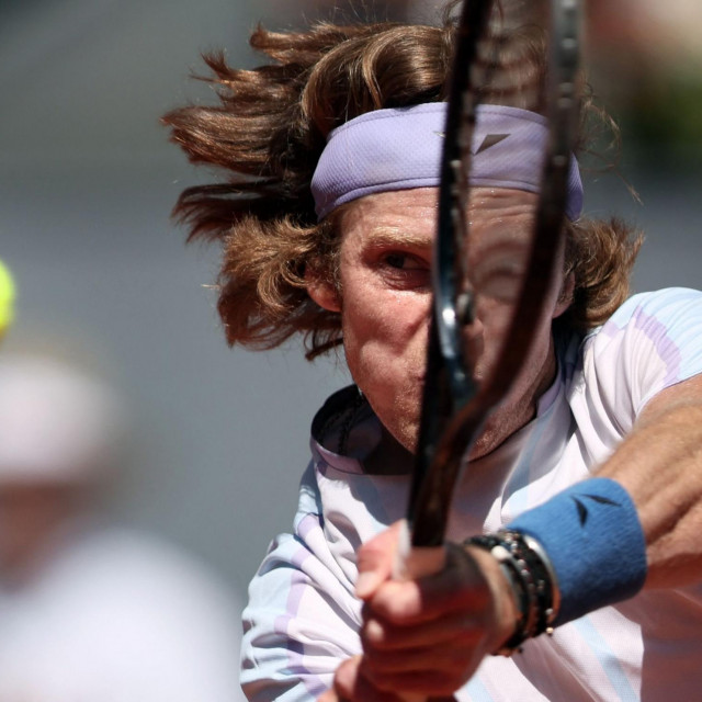 TOPSHOT - Russia‘s Andrey Rublev returns the ball to Russia‘s Karen Khachanov during their 2023 ATP Tour Madrid Open tennis tournament singles match at Caja Magica in Madrid on May 2, 2023. (Photo by Thomas COEX/AFP)