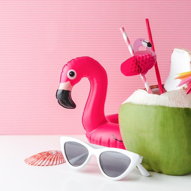 &lt;p&gt;Fresh coconut on a pastel pink background with flamingo inflatable drink holder and sunglasses, summer vibes concept&lt;/p&gt;