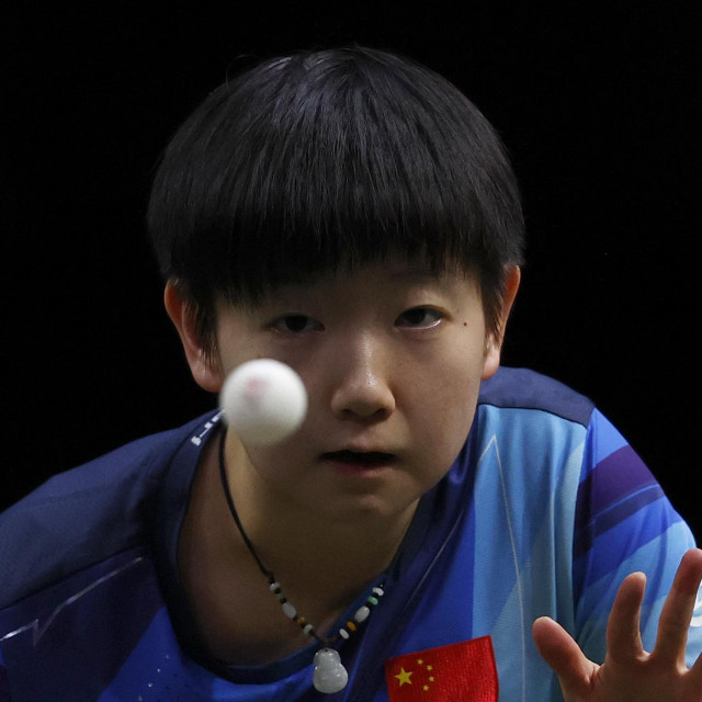 China‘s Sun Yingsha eyes the ball during the women‘s singles table tennis final match at the 2023 ITTF World Table Tennis Championships Finals in Durban on May 28, 2023. (Photo by PHILL MAGAKOE/AFP)
