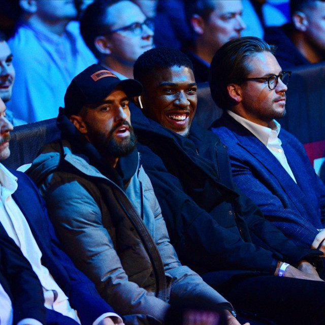 Anthony Joshua laughs in the audience during the Matchroom Boxing heavyweight fight between Dillian Whyte and Jermaine Franklin at the OVO Arena