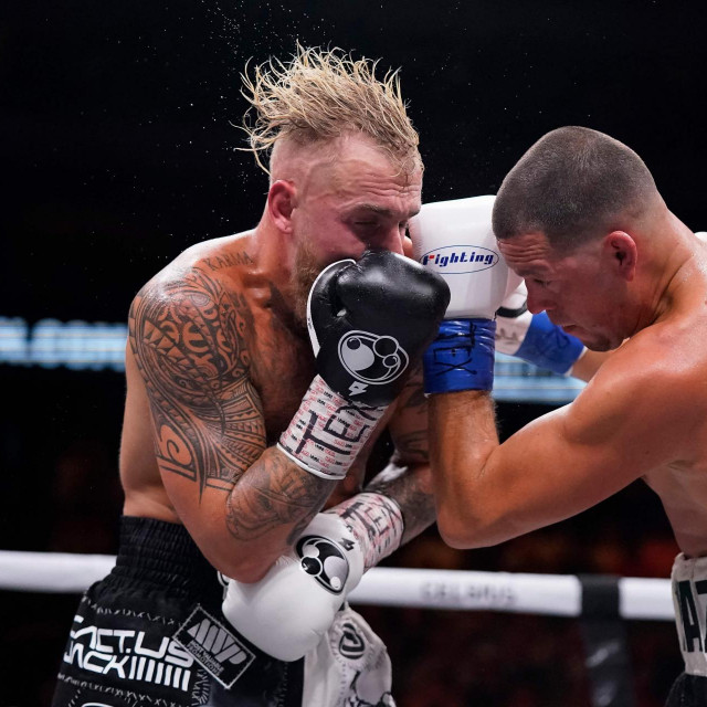 DALLAS, TEXAS - AUGUST 05: Jake Paul, left, and Nate Diaz, right, trade punches during the third round of their fight at the American Airlines Center on August 05, 2023 in Dallas, Texas. Sam Hodde/Getty Images/AFP (Photo by Sam Hodde/GETTY IMAGES NORTH AMERICA/Getty Images via AFP)