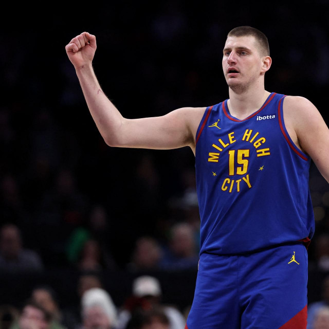 WASHINGTON, DC - JANUARY 21: Nikola Jokic #15 of the Denver Nuggets celebrates against the Washington Wizards during the second half at Capital One Arena on January 21, 2024 in Washington, DC. NOTE TO USER: User expressly acknowledges and agrees that, by downloading and or using this photograph, User is consenting to the terms and conditions of the Getty Images License Agreement. Patrick Smith/Getty Images/AFP (Photo by Patrick Smith/GETTY IMAGES NORTH AMERICA/Getty Images via AFP)