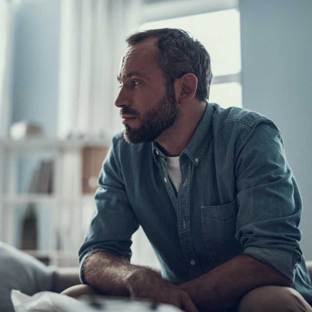 &lt;p&gt;calm bearded middle aged man sitting at home and thoughtfully looking into the distance&lt;/p&gt;