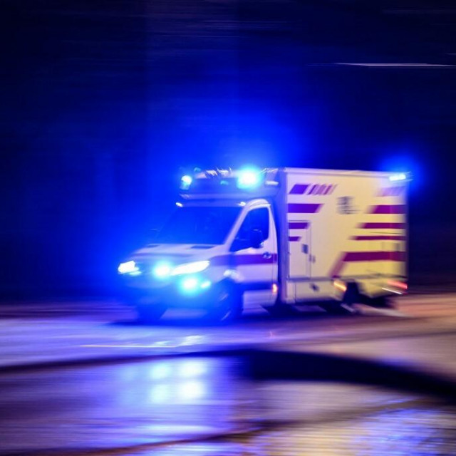 19 February 2024, Saxony, Dresden: An ambulance drives to an emergency on Lenn?stra?e in the Seevorstadt-Ost/Gro?er Garten district in the evening with flashing blue lights. (Shot with long exposure time) Photo: Robert Michael/dpa (Photo by ROBERT MICHAEL/DPA/dpa Picture-Alliance via AFP)
