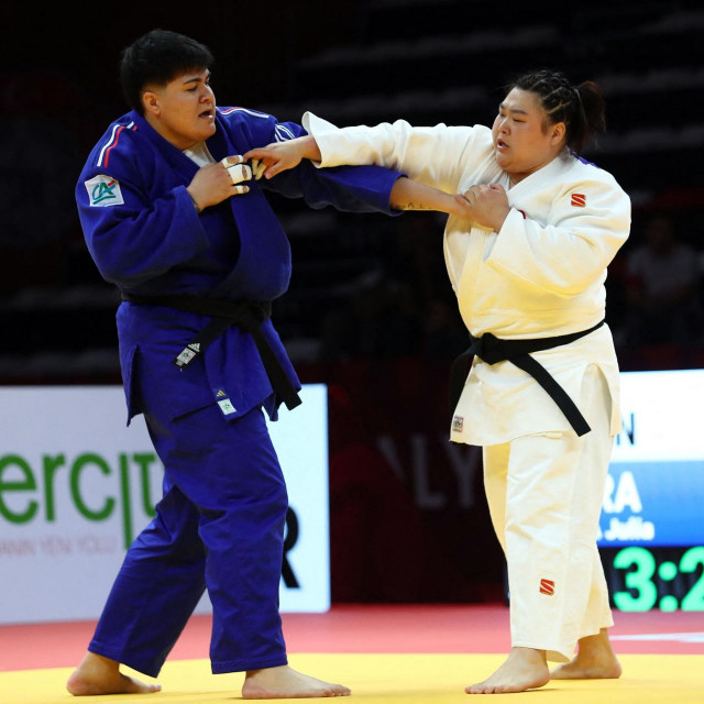 France‘s Julia Tolofua (Blue L) fights against China‘s Xin Su (white) in the Women‘s +78kg Final match during the Antalya Grand Slam judo tournament in Antalya on March 31, 2024. (Photo by ONER SAN/AFP)