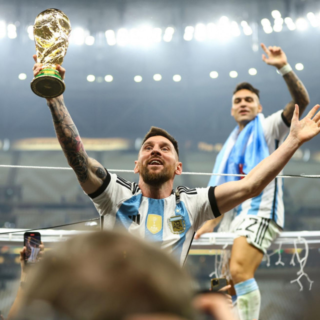 Lionel Messi lifts the trophy after Argentina win the World Cup