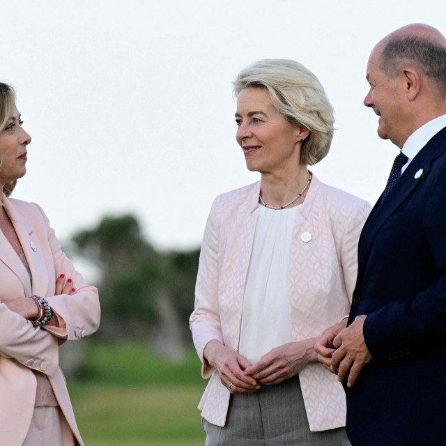 Italy‘s Prime Minister Giorgia Meloni (L) chats with German Chancellor Olaf Scholz (R) and President of the European Commission Ursula von der Leyen during a flags ceremony at Borgo Egnazia Golf Club San Domenico during the G7 Summit hosted by Italy in Apulia region, on June 13, 2024 in Savelletri. Leaders of the G7 wealthy nations gather in southern Italy this week against the backdrop of global and political turmoil, with boosting support for Ukraine top of the agenda. (Photo by Tiziana FABI/AFP)