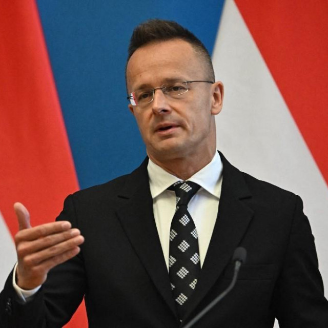 Hungary‘s Foreign Minister Peter Szijjarto gestures as he speaks during a joint press conference with Israel‘s Foreign Minister at the Foreign Office in Budapest, Hungary, on June 17, 2024. (Photo by Attila KISBENEDEK/AFP)