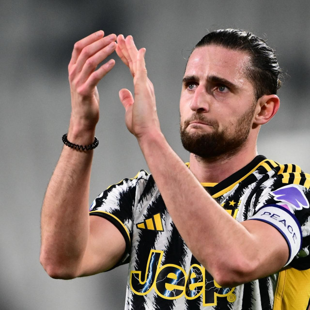 (FILES) Juventus French midfielder Adrien Rabiot greets fans at the end of the Italian Serie A football match between Juventus and Udinese at the �Allianz Stadium� in Turin on February 12, 2024. Adrien Rabiot is no longer a Juventus player after the Serie A club‘s sporting director Cristiano Giuntoli confirmed on July 18, 2024, that the France midfielder‘s contract would not be renewed. (Photo by MARCO BERTORELLO/AFP)