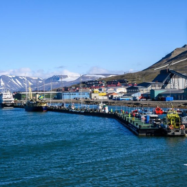 SVALBARD, NORWAY – JULY 17, 2023commercial dock and waterfront at Longyearbyn on a sunny summer day