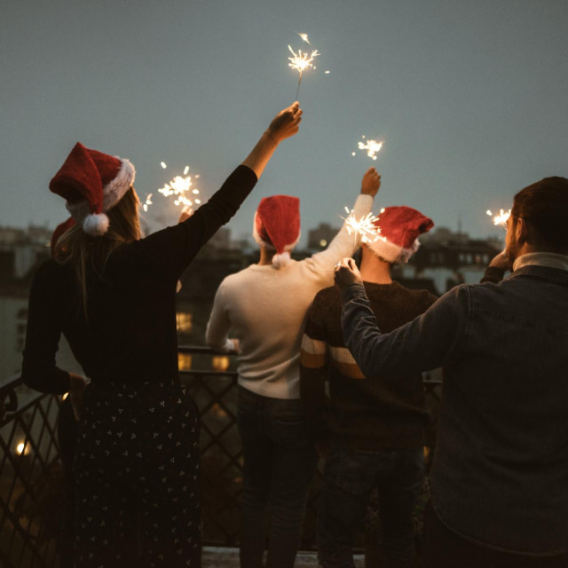 friends celebrate the christmas on the rooftop