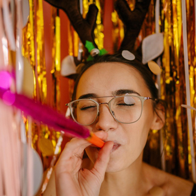 Photo of a young woman on New Year‘s eve celebration party