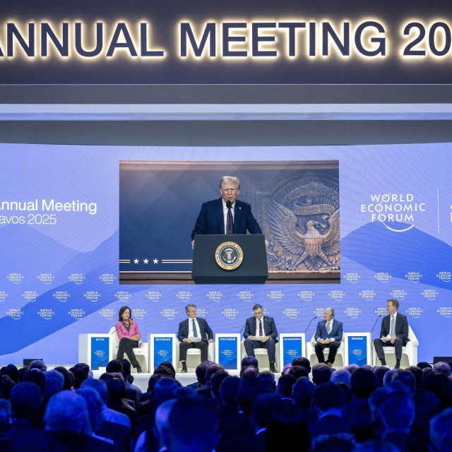 (From L) Santander Bank executive chairperson Ana Botin, Bank of America CEO Brian Thomas Moynihan, French energy group TotalEnergies CEO Patrick Pouyanne, Blackstone CEO Stephen A. Schwarzman World Economic Forum President and CEO Borge Brende attend a session as US President Donald Trump is seen on a giant screen during his address by video conference at the World Economic Forum (WEF) annual meeting in Davos on January 23, 2025. (Photo by Fabrice COFFRINI/AFP)